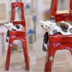 Kot na dużym czerwonym krześle