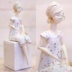 Sitting lady - white dress - birds and glasses - "M"