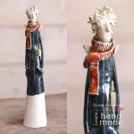 Ceramic angel with a book