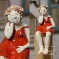 Gliniana figurka kobiety w czerwonej sukience.jpg